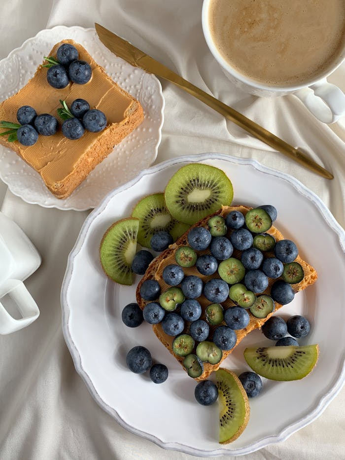 Appetizing toast topped with blueberries and kiwi, perfect for a healthy breakfast.